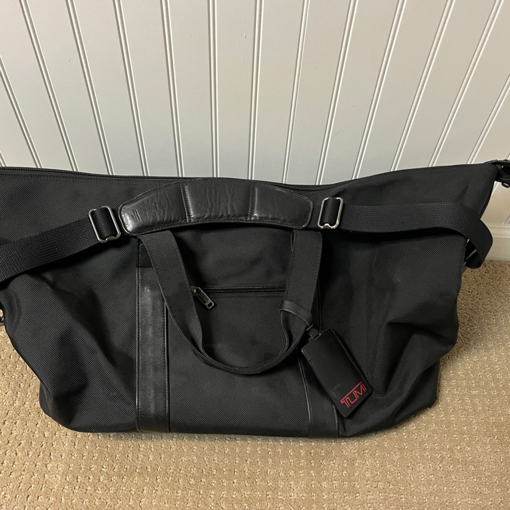 TUMI Black Duffel Bag with Red Accent